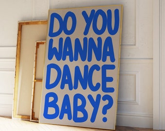 May include: A beige canvas with a gold frame featuring the text "Do you wanna dance baby?" in blue lettering.