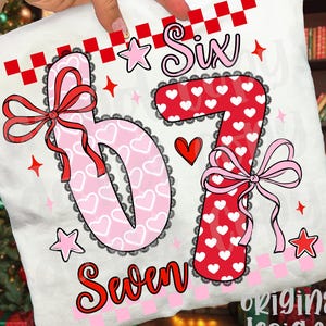 May include: White pillowcase with the numbers "6" and "7" in pink and red, decorated with hearts, bows, and stars. The word "Six" is above the "6", and "Seven" is below the "7". The design includes a checkered pattern.