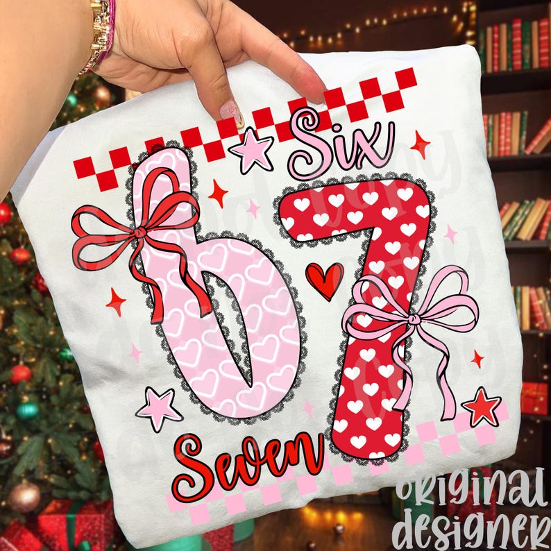 May include: White pillowcase with the numbers "6" and "7" in pink and red, decorated with hearts, bows, and stars. The word "Six" is above the "6", and "Seven" is below the "7". The design includes a checkered pattern.