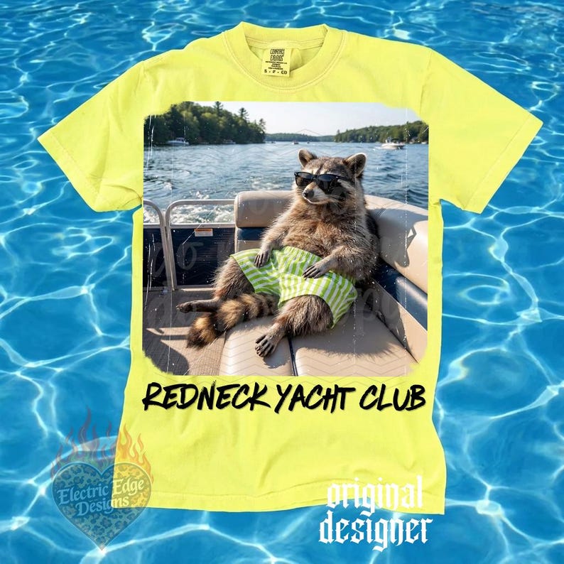 May include: Yellow t-shirt featuring a raccoon wearing sunglasses and green striped shorts, lounging on a boat. The shirt has the text "Redneck Yacht Club" in black. The shirt also has the text "original designer".