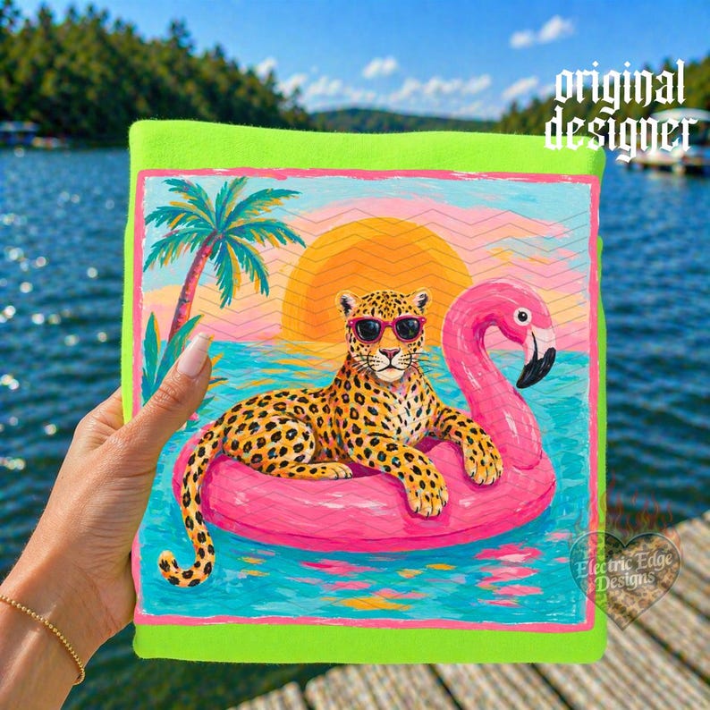 May include: A vibrant, neon green beach towel featuring a colorful illustration of a leopard wearing sunglasses, lounging on a pink flamingo float in the ocean. The background includes a sunset, palm tree, and the text "original designer".
