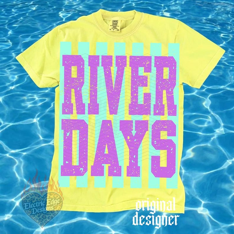 May include: A yellow t-shirt with the words "RIVER DAYS" in purple block letters, set against a background of vertical light blue stripes. The shirt has a vintage, distressed look, with the words slightly faded. The words "original designer" are at the bottom.