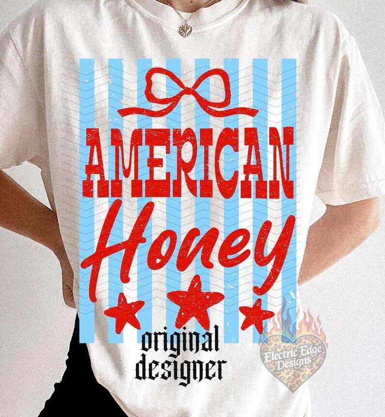 May include: Cream-colored t-shirt with a patriotic design. The design features the words "AMERICAN Honey" in red, with a red bow, blue and white stripes, and three red stars. The words "original designer" are below the text.