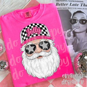 May include: A bright pink sweatshirt featuring a graphic of Santa Claus wearing star-shaped sunglasses and a checkered hat with the word "Jolly". The design is set against a pink background with the words "do" and "happy" repeated.