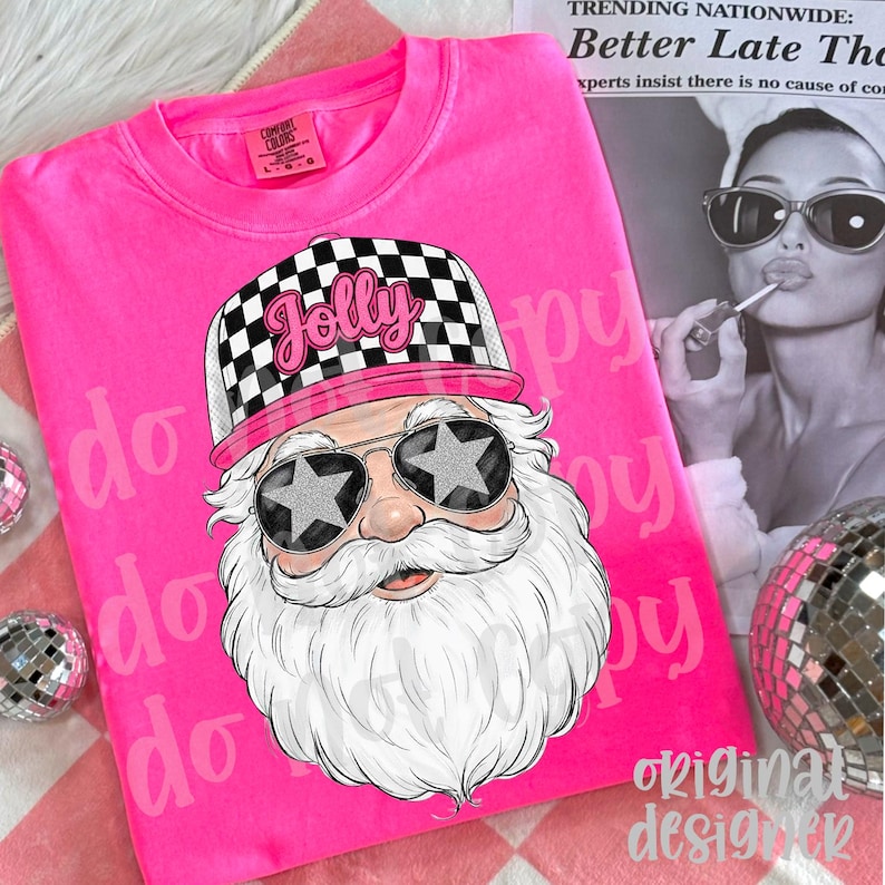 May include: A bright pink sweatshirt featuring a graphic of Santa Claus wearing star-shaped sunglasses and a checkered hat with the word "Jolly". The design is set against a pink background with the words "do" and "happy" repeated.