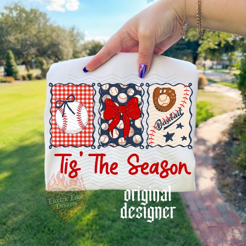 May include: A white t-shirt featuring three rectangular panels with baseball themes. The first has a red gingham background with a baseball, the second a navy blue background with baseballs and a red bow, and the third a baseball glove and stars. The text reads Tis The Season.
