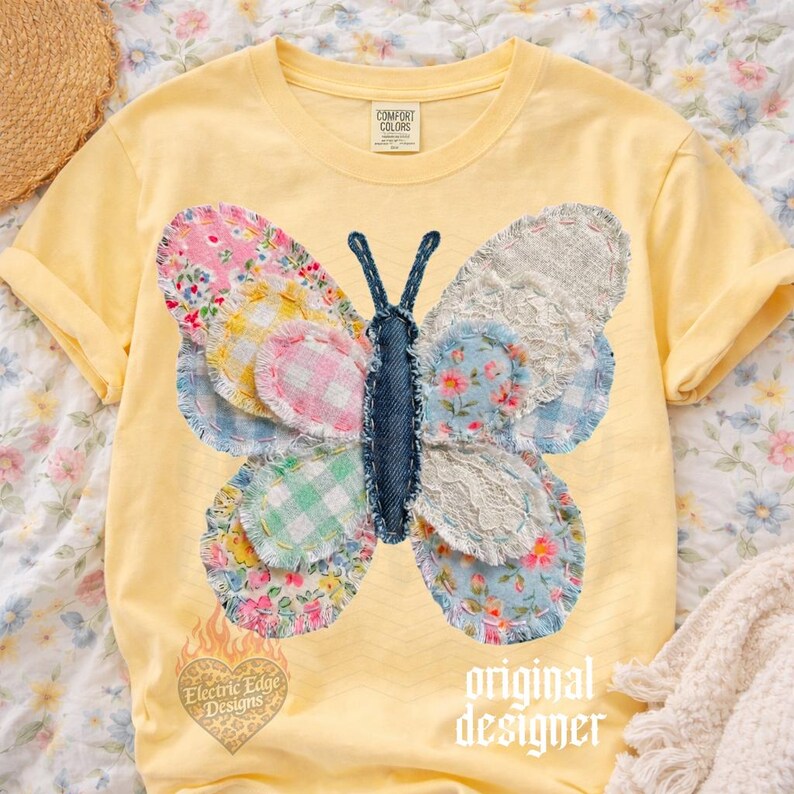 May include: A yellow Comfort Colors t-shirt featuring a patchwork butterfly design. The butterfly has wings made of various floral and patterned fabrics, with a denim body. The text "original designer" is printed on the shirt.