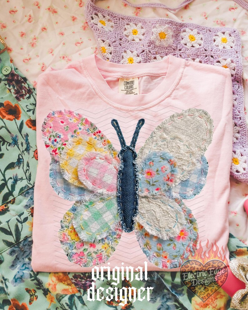 May include: A light pink Comfort Colors t-shirt featuring a patchwork butterfly design. The butterfly wings are made of various floral and patterned fabrics. The text "original designer" is printed at the bottom.