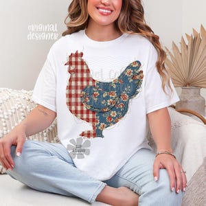 May include: White t-shirt featuring a patchwork chicken design. The chicken's body is split, with one half in a red and white plaid pattern and the other in a blue floral print. The text "original designer" is printed on the top left.