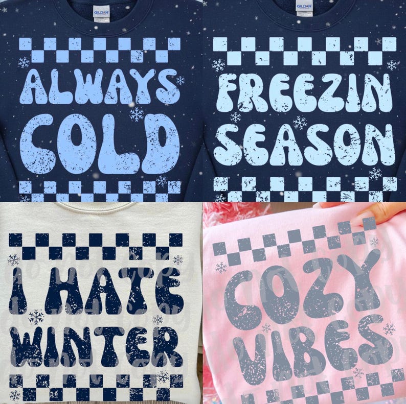May include: Four sweatshirts with winter-themed text. Two navy blue sweatshirts say "ALWAYS COLD" and "FREEZIN SEASON" in light blue. A light gray sweatshirt says "I HATE WINTER" in navy blue. A pink sweatshirt says "COZY VIBES" in gray.