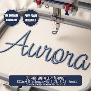 May include: A 3D puff embroidery design of the name Aurora in blue thread on light fabric within an embroidery hoop. Text includes BX FORMAT AVAILABLE, PUFF FOAM REQUIRED, and 3D PUFF EMBROIDERY ALPHABET 6 SIZES 3.8-5.1-6.4-7.6-8.9-10.2 CM.