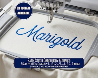 May include: An embroidery machine hoop holding white fabric with the blue embroidered word Marigold. A dark blue circular badge reads BX FORMAT AVAILABLE. A rectangular label states Satin Stitch Embroidery Alphabet, 7 Sizes, 10 File Formats, 1-1.5-2-2.5-3-3.5-4 inches, and lists file extensions.