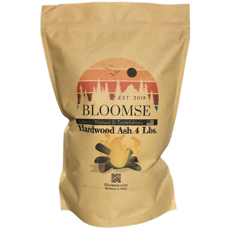 May include: A brown paper bag with a logo for Bloomse Hardwood Ash. The logo features a sunset scene with trees and a campfire. The bag contains 4 pounds of hardwood ash. The text on the bag reads "EST. 2019", "BLOOMSE", "Liberty, Nature & Tastefulness", "Hardwood Ash 4 Lbs.", "Bloomse.com", and "McHenry, IL 60051".