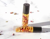 Rose Gold Hydrating Lip Oil Nourishing Infused Rose Petal Lip Oil with Rollerball Moisturizing Lip Oil Shine w rose petal gold flakes