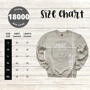 May include: A size chart for Gildan 18000 shirts, showing chest and length measurements in inches for sizes S through 3XL. The chart is printed on a light brown wooden background.