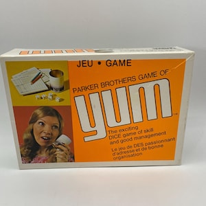 Juego de mesa de dados Yum de Parker Brothers: diversión clásica para toda la familia como Yahtzee