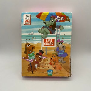 Vintage Pound Puppies Beach Jigsaw: 60-elementowa układanka retro z kreskówkowym psem ratownikiem dla nostalgicznej zabawy