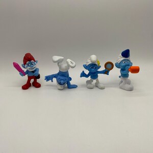 Collection de jouets Happy Meal McDonald's Schtroumpfs 2013 : personnages bleus emblématiques du film Peyo