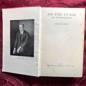 May include: A book titled "On the Stage: An Autobiography" by George Arliss. The cover features a black and white photo of the author.
