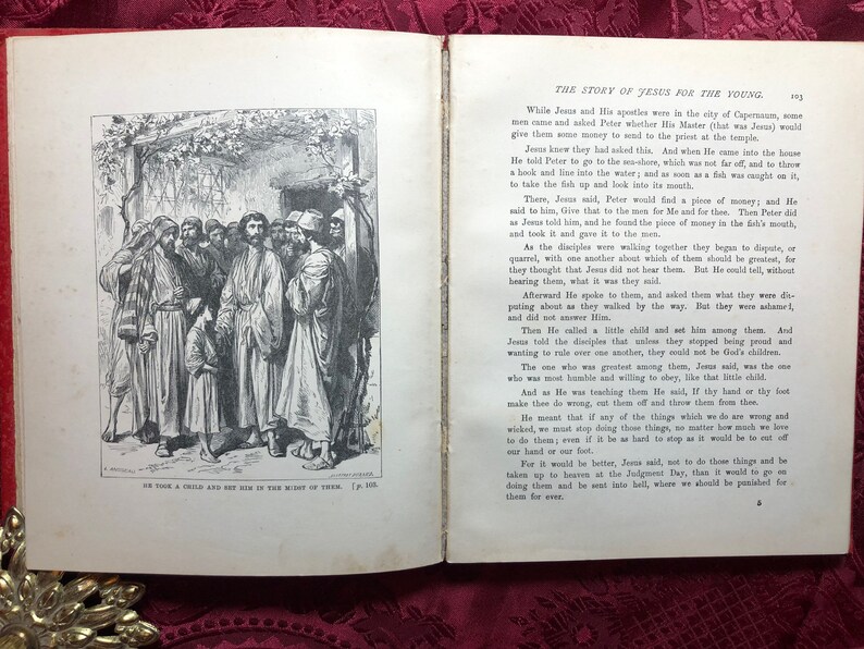 May include: A black and white illustration of a group of people standing in a doorway. The people are dressed in long robes and are looking at a child standing in front of them. The text "He took a child and set him in the midst of them." is printed below the image.
