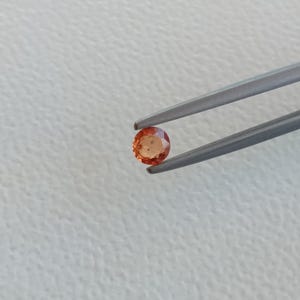 0.25 crt.  Sapphire. Natural. Facet (heated).  3.66-3.69 mm. round x1.97 mm. Depth.