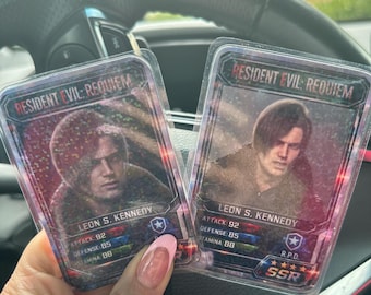RE Leon Kennedy Inspired Laminated Trading Cards Set of 3. 1 mystery one.