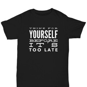 May include: Black t-shirt with white text that reads "Think for yourself before it's too late."