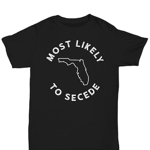 May include: Black t-shirt with a white outline of the state of Florida and the text "Most Likely To Secede".