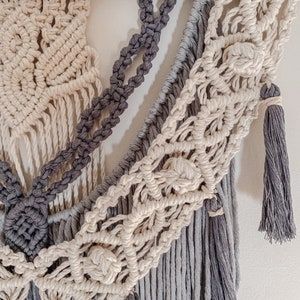 Close up details of a popular macrame pattern using four colours of rope and featuring more than 6 type of knots.