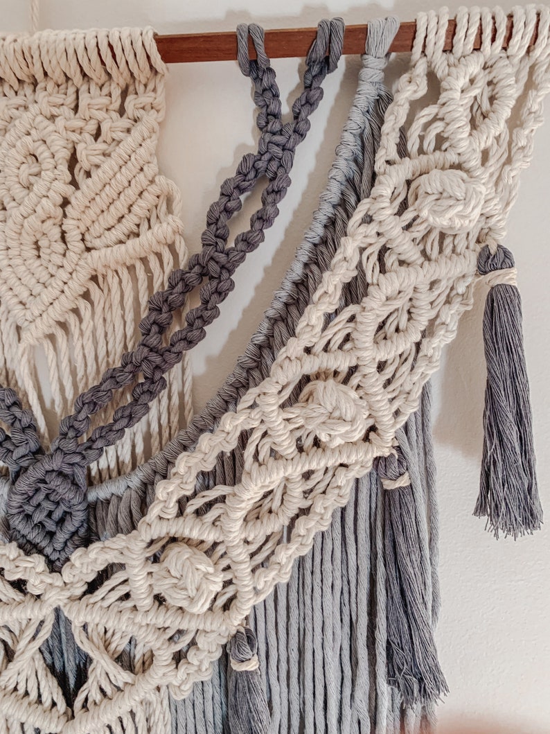 Close up details of a popular macrame pattern using four colours of rope and featuring more than 6 type of knots.