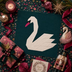 May include: A square dark green fabric panel featuring a geometric white swan appliqué with a black and pink beak. The swan is constructed from angular fabric segments, creating a stylized, modern representation of the bird on a solid background.