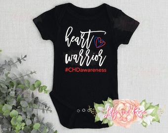 May include: Black baby onesie with white text that reads "heart warrior #CHDAwareness". The text is in a cursive font and includes a red and blue heart.