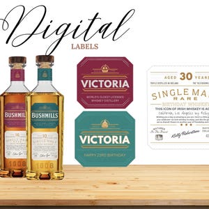 May include: Two bottles of Bushmills Single Malt whiskey with labels, alongside digital label designs for whiskey bottles. The labels feature text like "Victoria" and "Happy 23rd Birthday", and "Single Malt Rare". The image is set on a wooden surface.