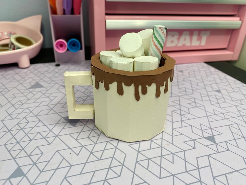 This is the back of the hot cocoa mug with the dripping chocolate wrapping all the way around.
