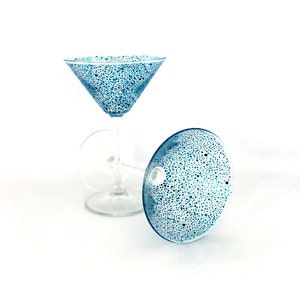 A pair of blues polka dot cocktail/martini glasses