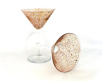 A pair of amber polka dot cocktail/martini glasses