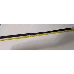 May include: A black belt with a silver buckle is laid out next to a yellow measuring tape. The belt appears to be made of leather and is approximately 40 inches long.