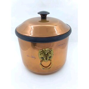 May include: Copper ice bucket with a lion head handle and a black lid.