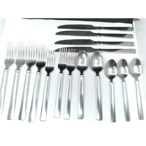 May include: A collection of stainless steel flatware including four dinner knives, five dinner forks, two salad forks, two large spoons, and three small spoons. Each piece features a smooth, polished finish with a simple, straight handle design.