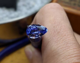 3.35 Ct. (VVS) Clarity Rated, Precision Master Cut, Wonderful Deep Violet and Blue Tanzanite. A Wonderous And Glimmering Gemstone!