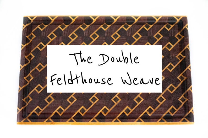 May include: Rectangular wooden chopping board with a geometric pattern in shades of brown and gold. The text "The Double Feldthouse Weave" is written in black on a white rectangle in the centre of the board.
