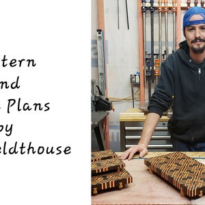 May include: A man in a blue baseball cap and black sweatshirt stands in a workshop with several wooden cutting boards in front of him. The boards have a geometric pattern of black, brown, and orange wood. The text "Pattern and Build Plans by Ryan Feldthouse" is visible in the image.