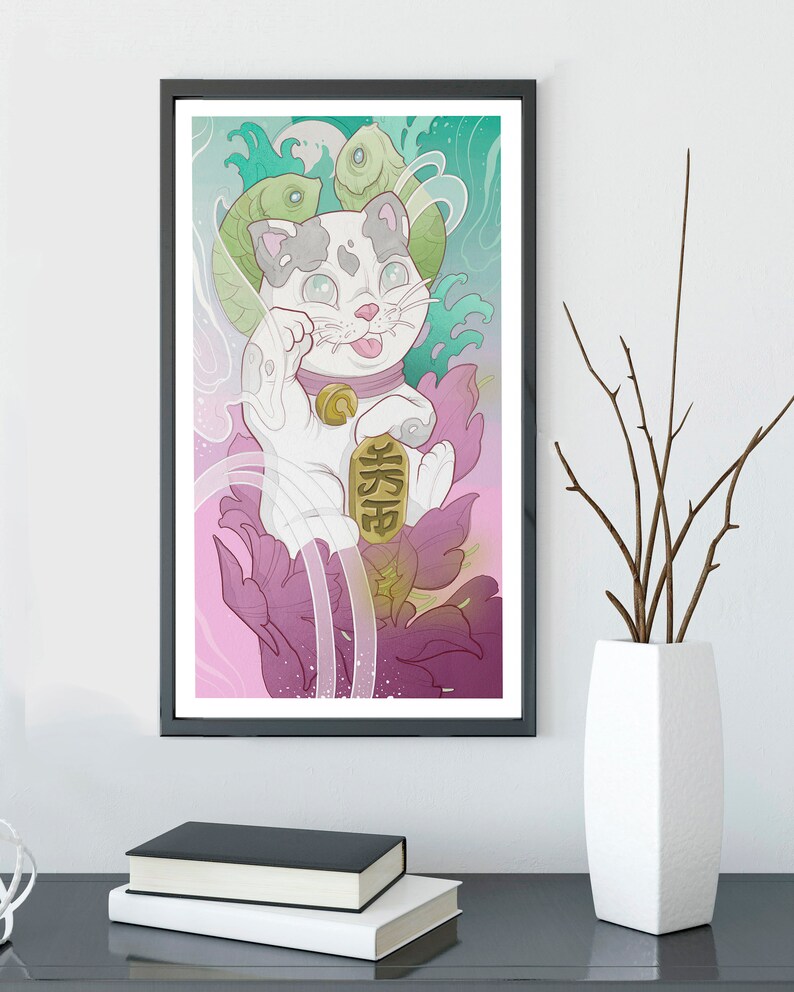 May include: A white Maneki-Neko, or lucky cat, with a gold coin and the Japanese character for 'fortune' on its paw. The cat is surrounded by pink and green floral designs and fish.
