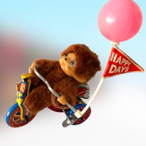 Vintage Monchichi on metal tin tricycle bicycle wind-up toy