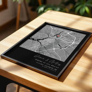 May include: A white ceramic mug with a black handle and the text "But First, Coffee" in a bold, black font. The mug is set against a blurred background, suggesting a cozy setting. The mug appears to be approximately 4 inches tall.