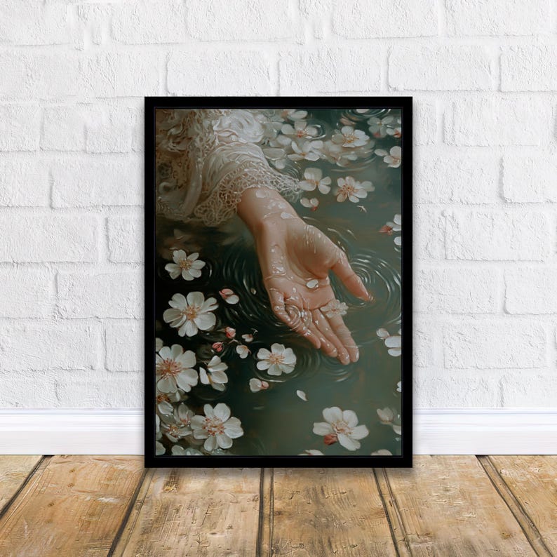 May include: A hand reaches out from a pool of water, surrounded by white flower petals. The water is a deep green color, and the petals are scattered around the hand.