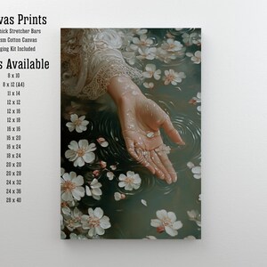 May include: A hand reaches out from a pool of water with white flower petals floating on the surface. The water is a dark green color and the hand is pale. The image is a canvas print with a 2cm thick stretcher bar and 325gsm cotton canvas. Sizes available are listed on the left side of the image.