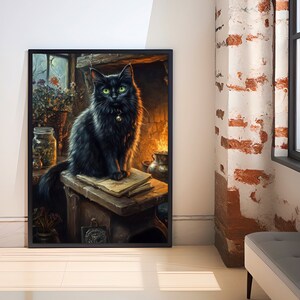 May include: Framed art print featuring a black cat with green eyes, sitting on a wooden surface with an open book. The cat wears a collar with a bell. The background includes a fireplace, jars, and a window, creating a cozy, vintage aesthetic.