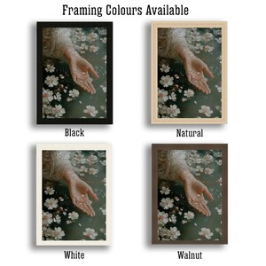 May include: Four different framing options for a print of a hand reaching into a pool of water with white flowers. The framing options are black, natural, white, and walnut.