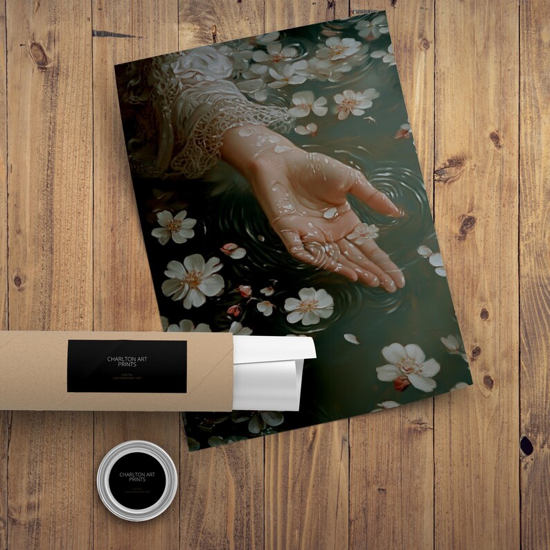 May include: A hand reaches out from a pool of water, surrounded by white blossoms. The water is rippling, and the hand is holding a small, shiny object.
